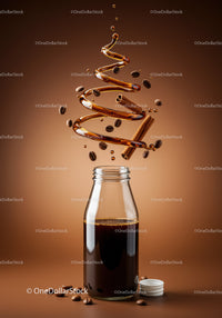 Glass bottle with coffee and swirling syrup with spices