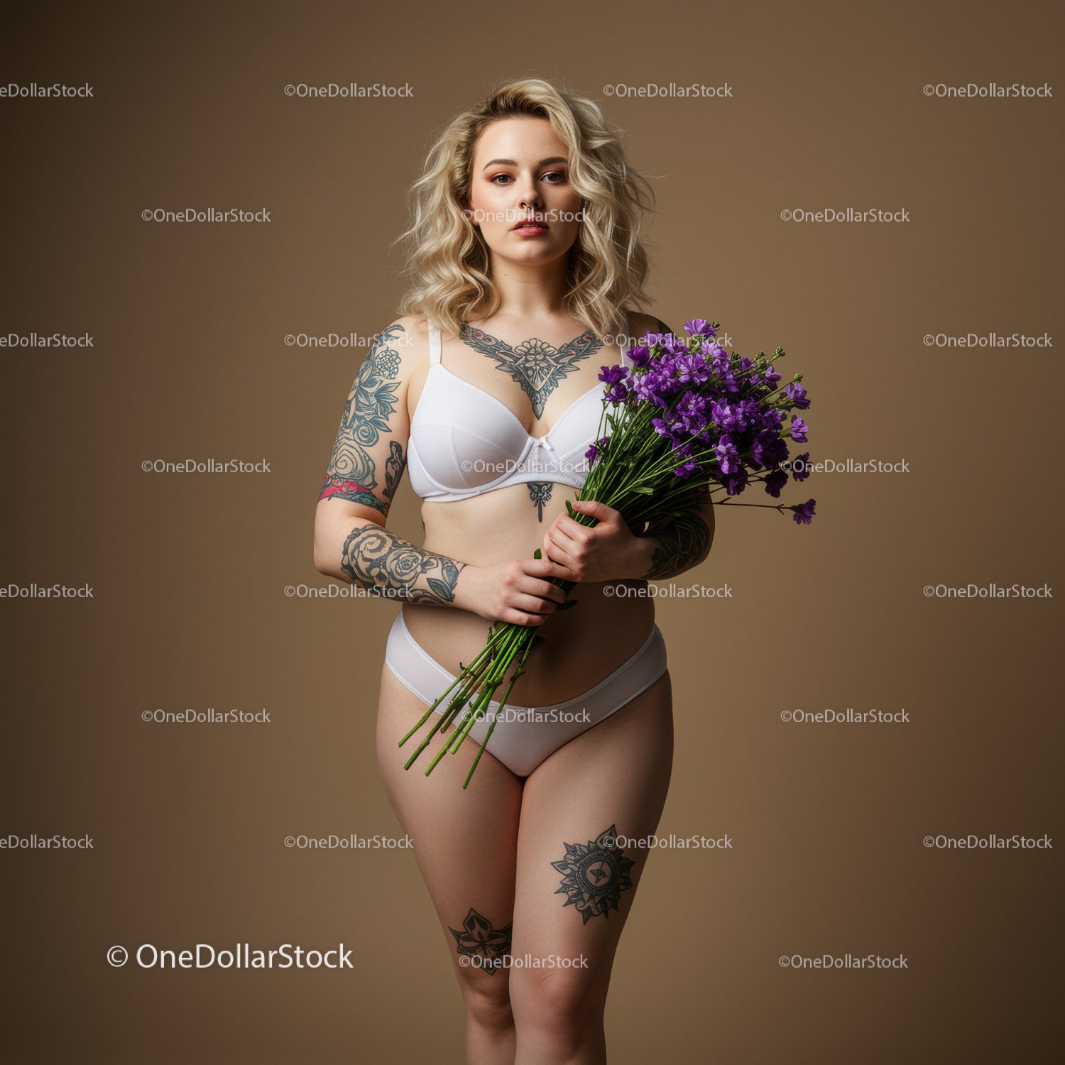 Elegant Woman with Tattoos Holding Purple Flowers in Studio