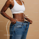 Slim Woman in Weight Loss Journey Showing Toned Abs and Loose Jeans