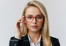 Stylish Blonde Woman Wearing Red Glasses in Professional Setting