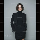 Stylish Woman in Black Business Suit Posed Confidently