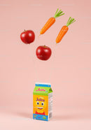 Fruit and vegetable balloons lifting juice carton
