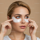 Young Woman Applying Under Eye Patches for Rejuvenation and Skin Care