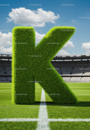 Large Grass Covered Letter K on Soccer Field