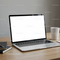 Modern laptop with blank screen on wooden desk setup
