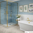 Elegant bathroom with blue tiled shower and white bathtub