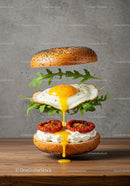 Poppy Seed Bagel with Fried Egg and Sun-Dried Tomatoes