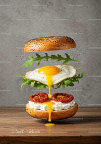 Poppy Seed Bagel with Fried Egg and Sun-Dried Tomatoes