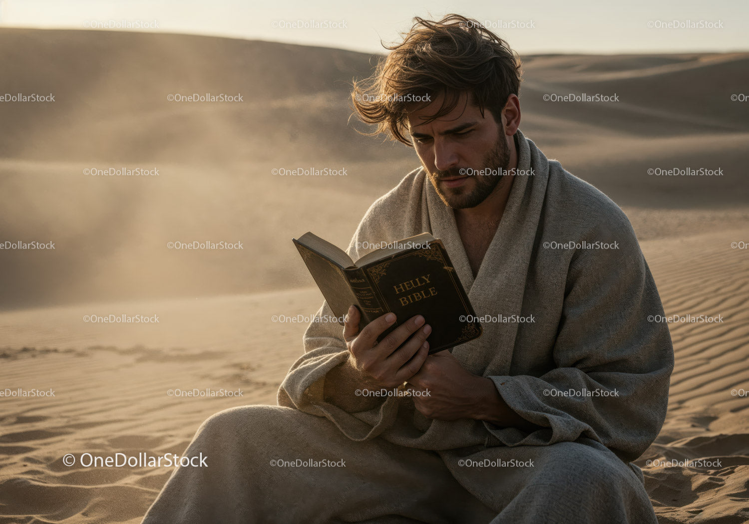 Man Reading Bible in Desert with Sand Dunes and Wind