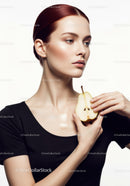Elegant Woman Holding Fresh Pear for Health and Beauty Concept