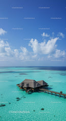Overwater Bungalow with Crystal Clear Turquoise Water and Blue Sky