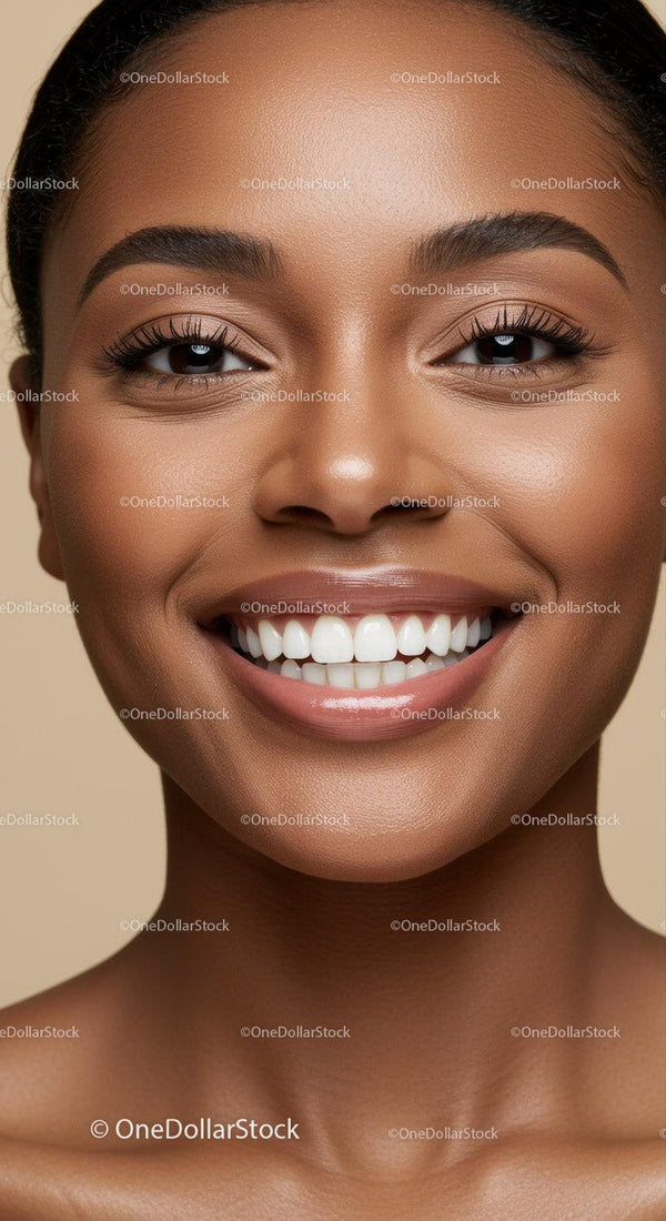 Close-up of smiling woman with flawless skin