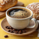 Freshly Brewed Coffee with Beans and Pastry on Wooden Plate