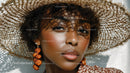 Elegant Woman Wearing Wide Brim Straw Hat with Summertime Style