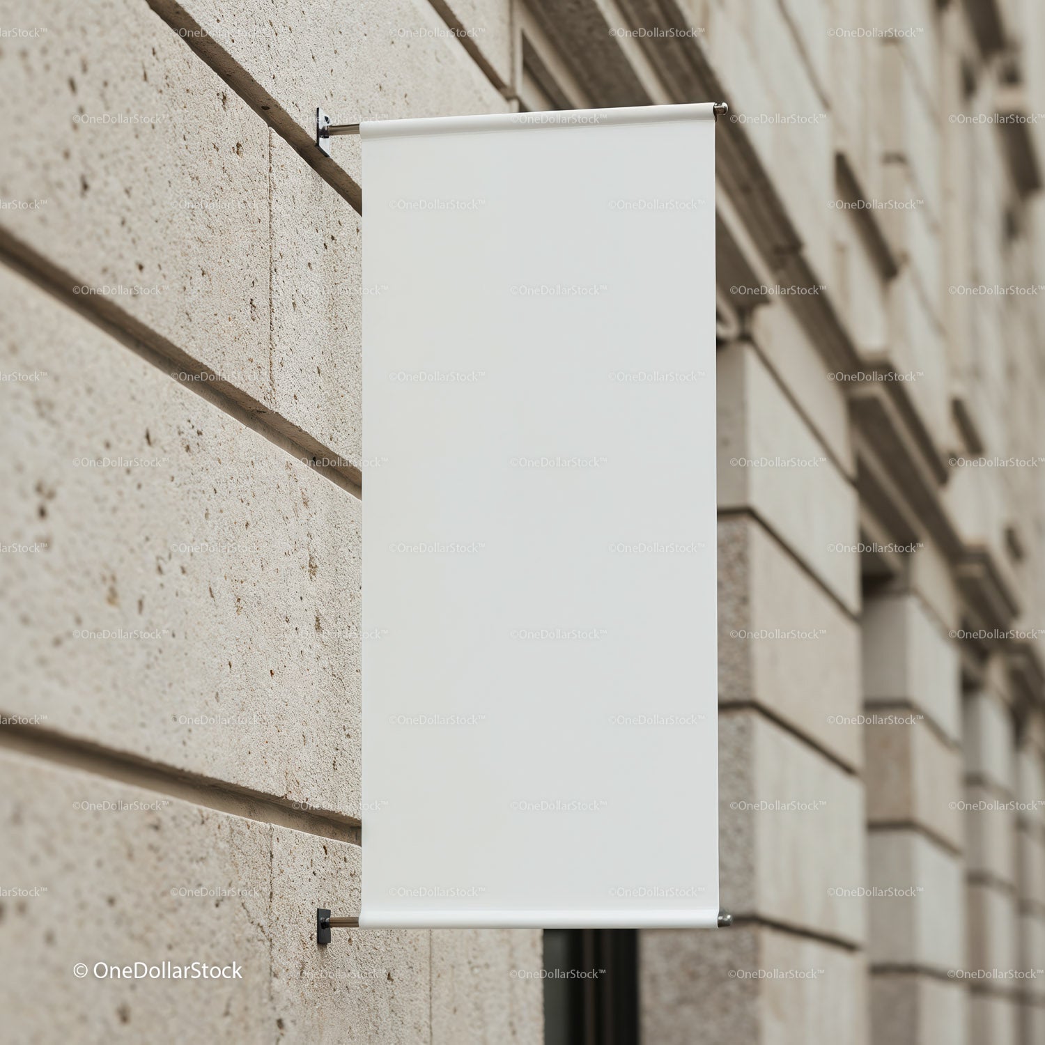 Blank white banner hanging on urban stone wall