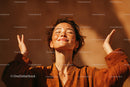Joyful Woman with Freckles and Short Hair Enjoying Sunshine