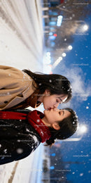 Couple Sharing a Tender Kiss on Snowy Winter Night
