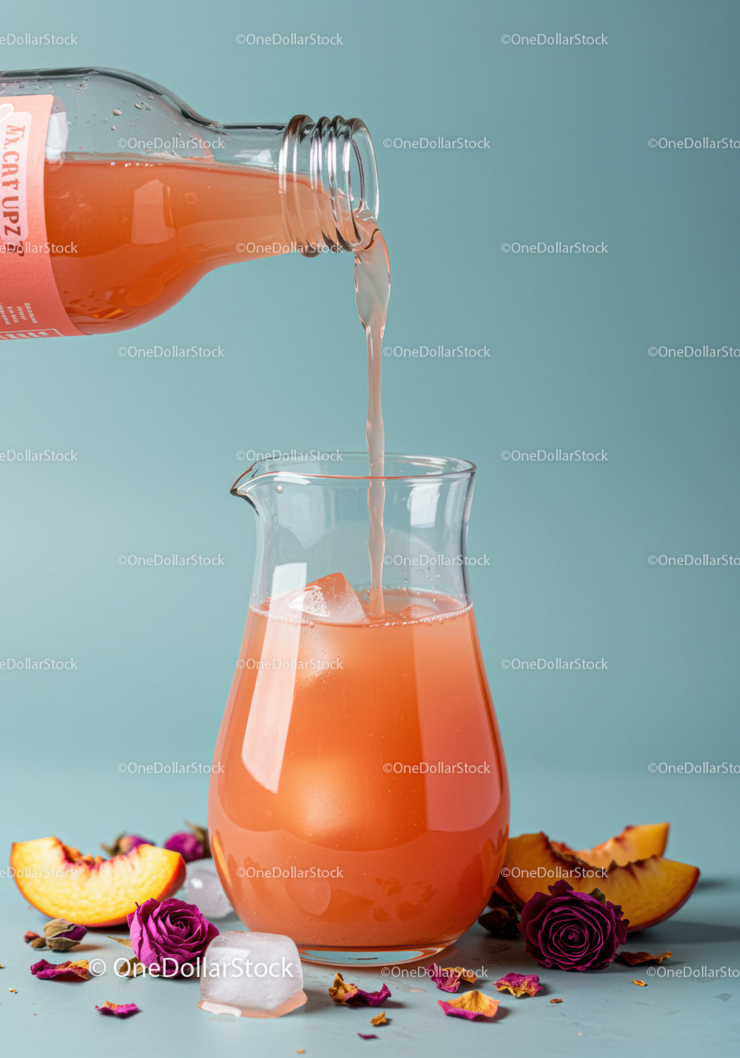 Refreshing peach juice pouring into glass pitcher