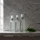 Clear Spray Bottles on Marble Surface with Green Leaves JPG Mockup Image preview