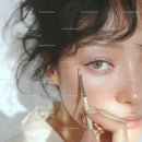Close-up of Woman Applying Eye Makeup with Brush