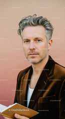 Confident Middle-Aged Man in Brown Velvet Blazer and White T-Shirt