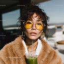 Stylish Woman Wearing Sunglasses and Fur Coat with Green Drink