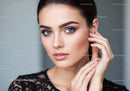 Portrait of a Beautiful Woman with Blue Eyes and Elegant Makeup