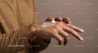 Close-Up of a Hand Applying Moisturizer Cream with Soft Skin