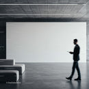 Businessman walking past modern minimalist lobby interior