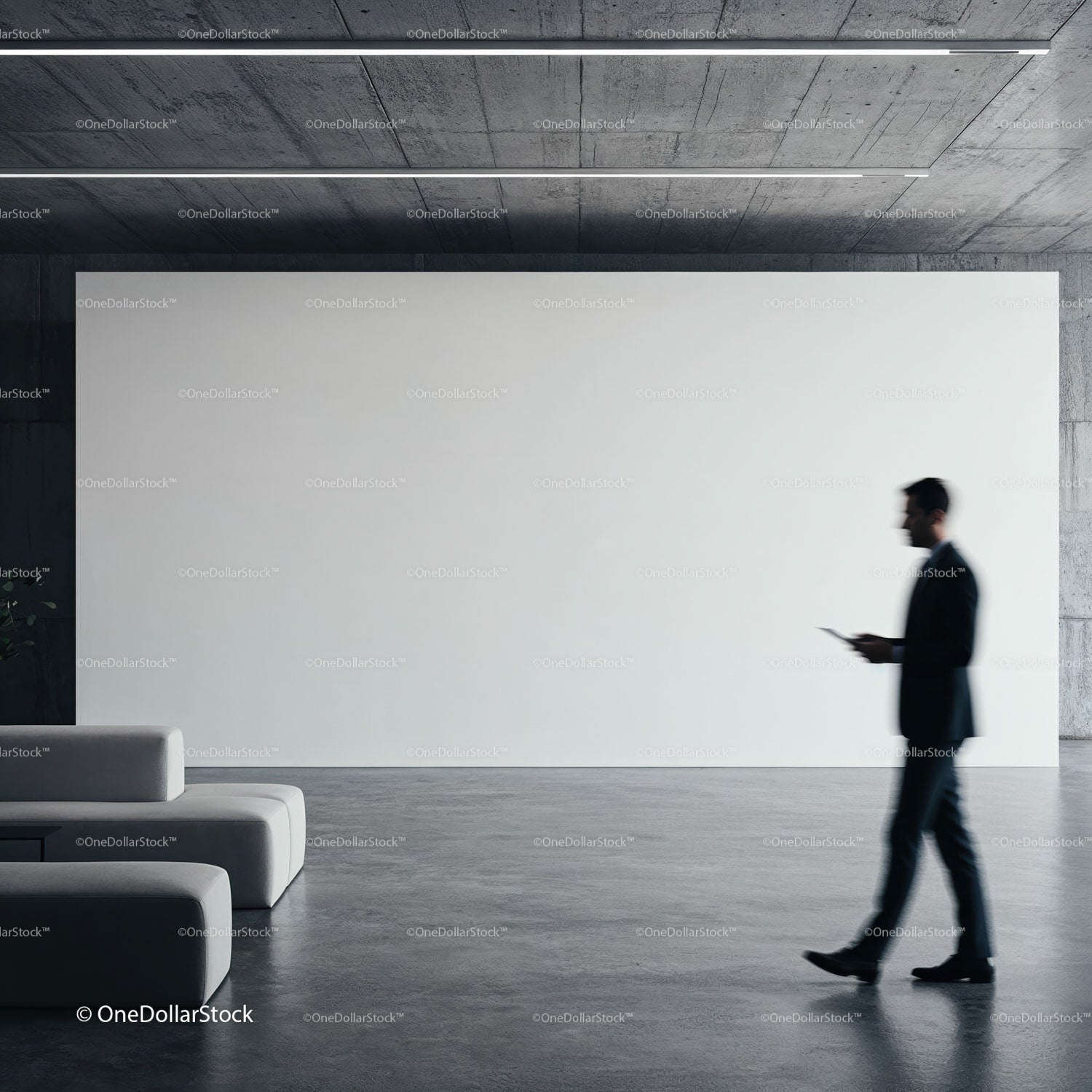 Businessman walking past modern minimalist lobby interior