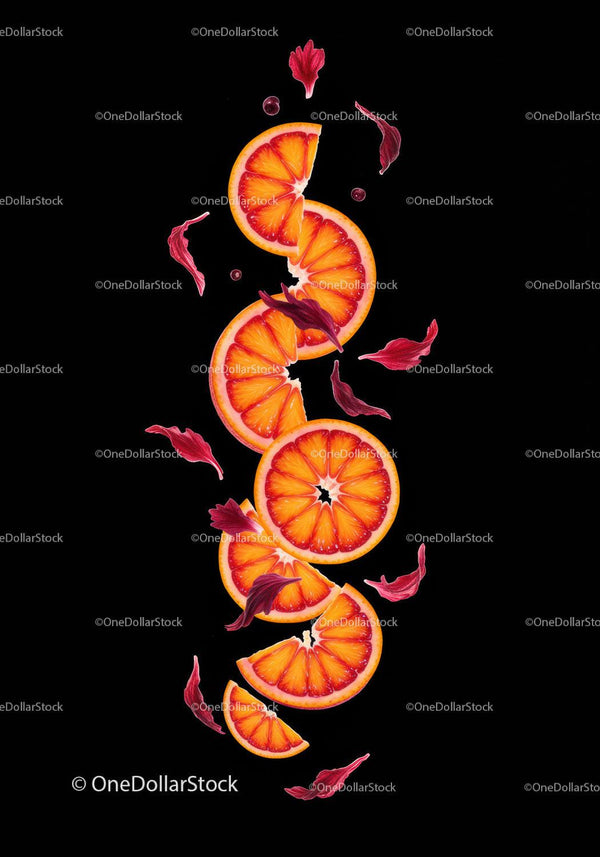 Blood orange slices with red flower petals arrangement