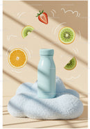 Refreshing bottle with fruit slices on soft fabric