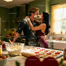 Couple Playfully Baking Heart Cookies in Cozy Kitchen