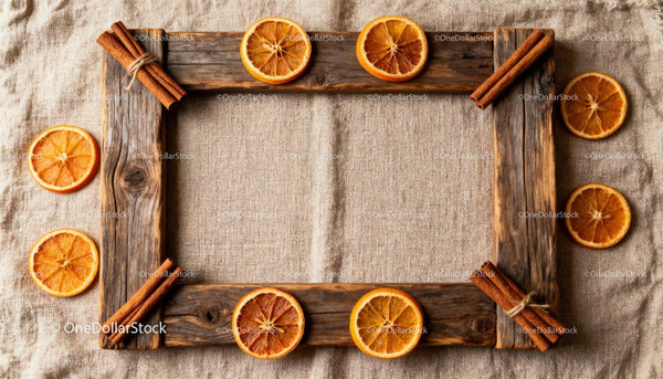 Rustic wooden frame with dried orange slices and cinnamon sticks