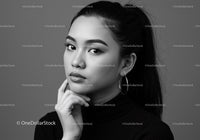 Elegant Black and White Portrait of a Confident Woman with Hoop Earrings