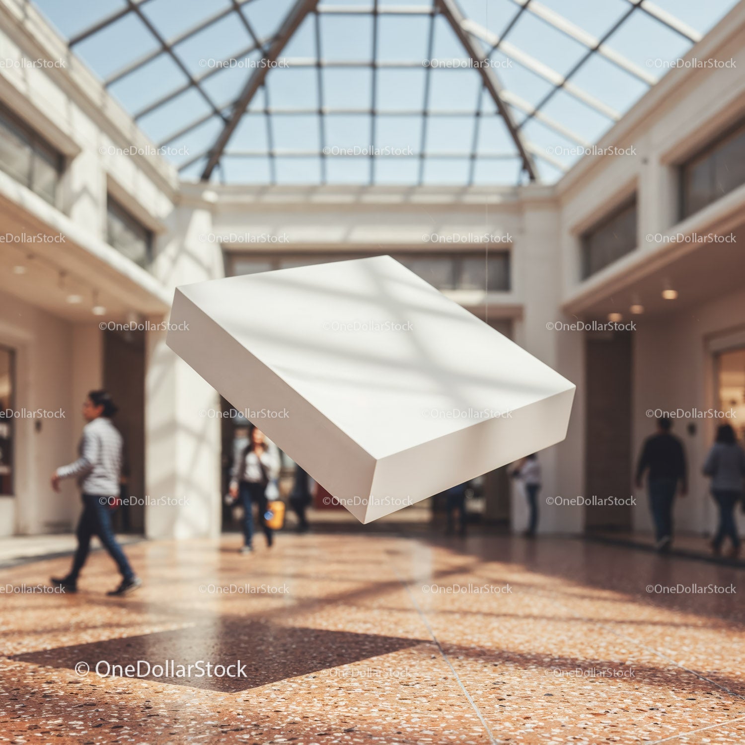 Floating white box in bright shopping mall atrium