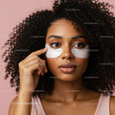 Young Woman with Curly Hair and Under Eye Gel Patches on Pink Background