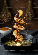 Spiced apple slices with cinnamon over melting butter