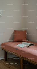 Cozy Bedroom with Soft Pillow and Open Book on Wooden Bed Frame