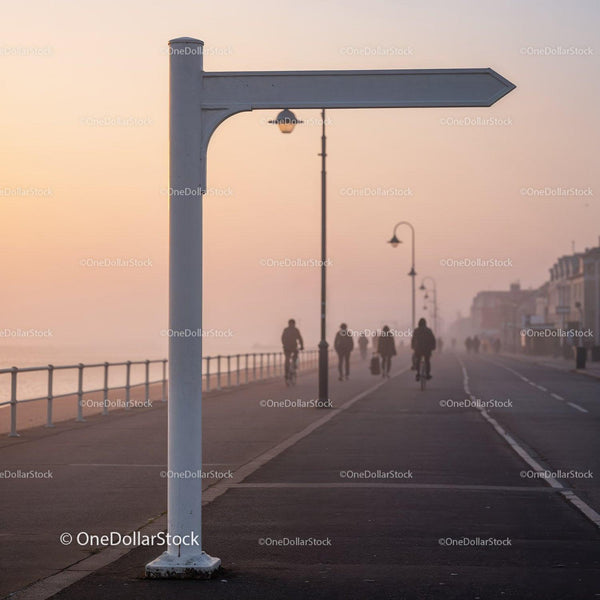 Empty Directional Sign by Seaside Promenade at Sunrise JPG Mockup Image