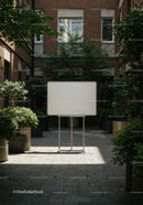 Blank whiteboard standing in serene urban courtyard