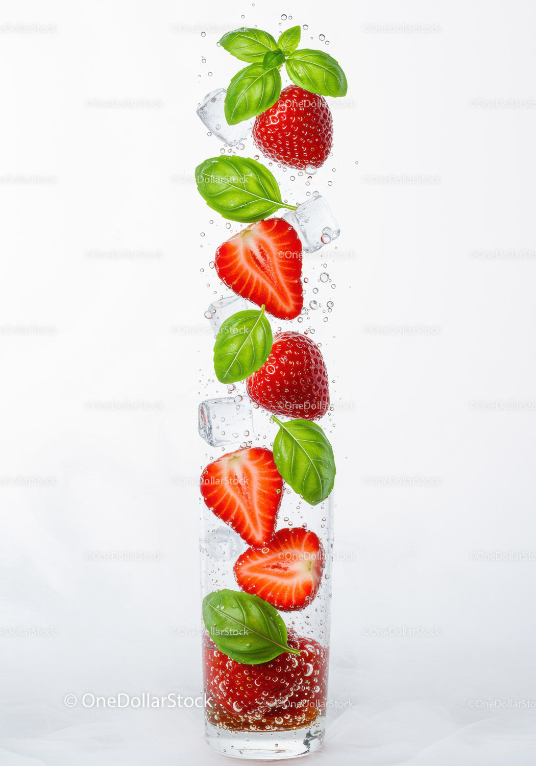 Refreshing sparkling water with strawberries and basil leaves