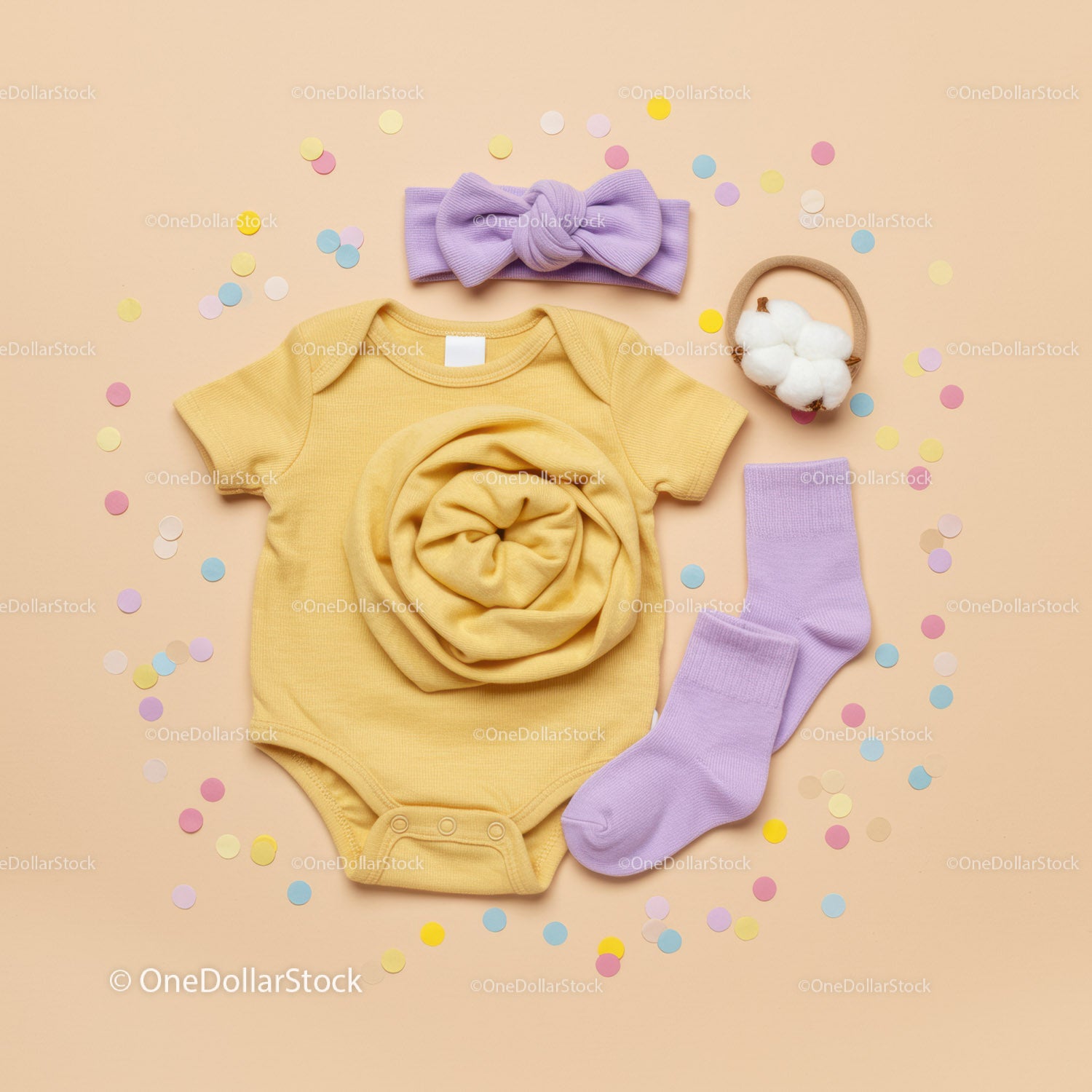 Soft yellow baby bodysuit with pastel accessories set