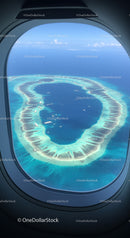 Aerial View of Tropical Island Atoll Surrounded by Turquoise Lagoon
