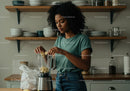 Young Woman Preparing Banana Smoothie in Modern Kitchen