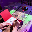 Writing a Romantic Note with Wine on Rustic Wooden Table