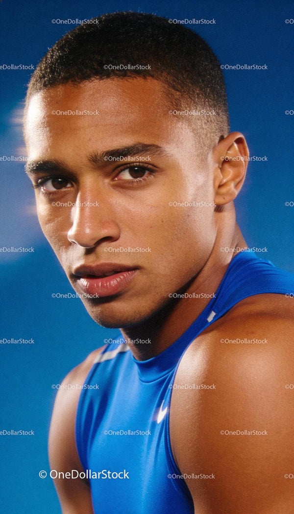 Focused young athlete in blue sportswear portrait