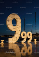 Large illuminated 999 sculpture by marina at night