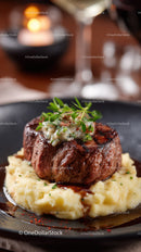 Gourmet Beef Steak Served on Creamy Mashed Potatoes with Herb Garnish