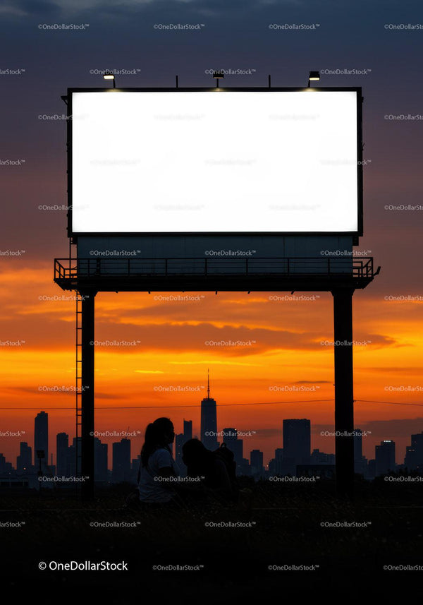 Couple Sitting Near Blank Billboard at Vibrant Sunset JPG Mockup Image